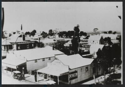 Black and White photograph.  Post Office, G A  Rock Store, J A Harman - Ford Dealer.  First bowsers filled by tanker from Perth