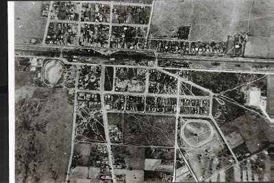Black and White photograph.  Aerial view of town