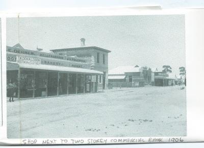 Copy of Photograph.  Black and White Shop next to 2 storey building, Commercial Bank 1906