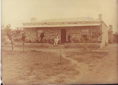 Black and White photograph - Milligan Homestead. Kellerberrin Bencubbin Road.  Shows homestead 4 people on verandah