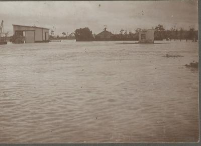 Black and White Photograph showing Doodlakine Railway Station with flood water 1915.