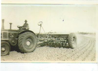 Black and White photograph Tractor and Combine