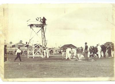 Black and White photograph 1929 Kellerberrin Fire Brigade Running Team competing at Perth Oval. Ladder run event.