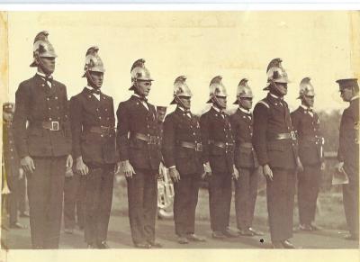 Black and White photograph 1929 Kellerberrin Fire Brigade Running Team 1929.  Team in dress uniform being judged before Marching event