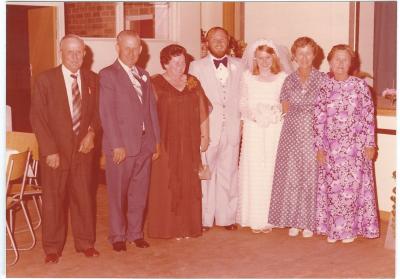 Colour photograph.  Wedding photo of Helen Smith and Danny Healy. Jack and Treasure Smith - Farmers South Kellerberrin.  Harry Smith Jack Smith, Treasure Smith, Danny Healy, Helen Healy, Phyllis Chinnery, Ada Jones