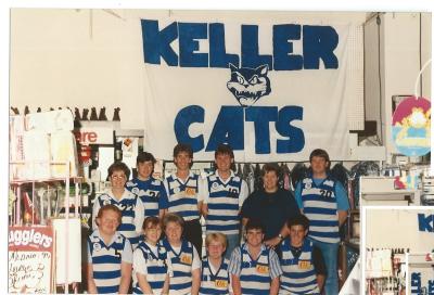 Colour photograph of staff at Kellerberrin Farmers Co-op dressed in football guernseys to support Kellerberrin Kats football club.  Diane Williams, Garry France, Tim Metcalf, Veronica Kent, Stephen Alcock. Neil Smith, Jodie Neale, Tanya Dale, Marnie Sa...