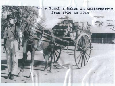Black and white photograph.  Percy Punch with horse and cart - with bread.  Percy was the Kellerberrin Baker
