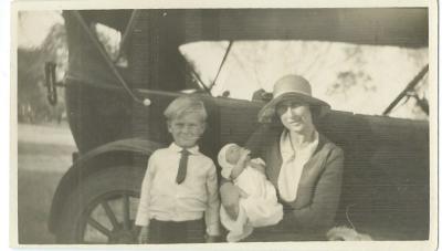 Black and White photograph.  Doodlakine 1930.  Writing on back of photograph - "Bill, Betty & Kath.  Just home with my new parents and brother Bill"