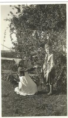 Black and White photograph.  Betty Nomnus and Lesley Nicholls.  Dress up "Little Mr Baggy Breeches"