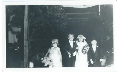 Black and White photograph.  Children Dress Ups.  Bride and Bridegroom - Bill Nomnus and Pattie Hamersley. Bridesmaid - Meryl Jenning Best Man - Paul Hanrahan Doodlakine 1930