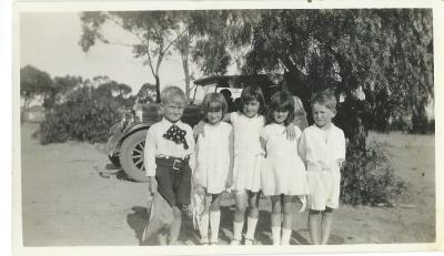 Black and white photograph.  Taken at Doodlakine Show Grounds - 1932. "Skippy" Bill Nomnus, Verna Jennings, Mary Hamersley, Pat Hamersley, Paul Hanrahan