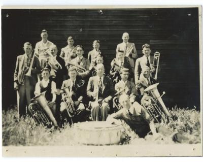 Black and White photograph -  Kellerberrin Brass Band 1946 Back Row: H Skidmore, J Howlett, C Fleming, W Chester Middle Row:  S Thomson, L Hubble, R Hicks, B Jahn, C Fleming Sitting: L Jones,       , J Blee, R James, W Hicks Standing Left : K Hicks