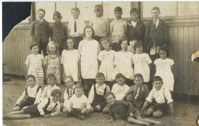 Black and White photograph.  School  photo Junior Room 1926. Back Row : Jim Campbell, Stanley Garwood, Bert Bandy, Walter Garwood, Alby Lowe, Ken Elphick, Frank Gough Middle Row :  Jessie Leopold, Shirley Prowse, Dulcie Noack, Evelyn Taylor, Dorothy Ta...
