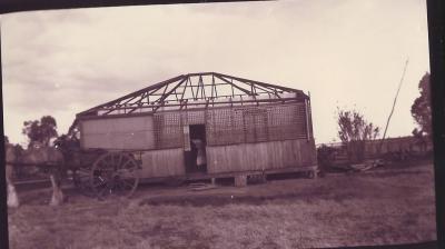 Black and White photograph of shed with missing roof.  Inscription supplied - on Macobs after a willy willy