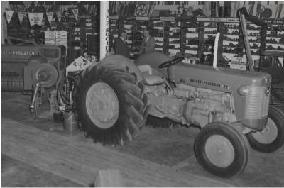 Black and White photograph.  Cargers selling Massey Ferguson equipment at the central Massingham St site - now the Community Resource Centre