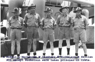 Black andWhite photograph.  5 soldiers  standing in front of war equipment. A McBain, L McLennan, W Chambers, W Nicholson, B Skillen.  All except Nicholson were taken prisoner in Crete