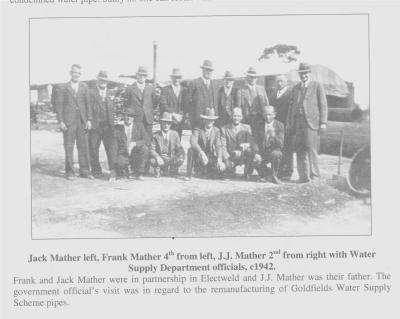 Copy of Black and White photograph. Jack Mather left, Frank Mather 4th from left. JJ Mather 2nd from right with Water supply officials.  Frank and Jack Mather were in partnership in Elecweld and J J Mather was their father.  The Govt officials visit wa...