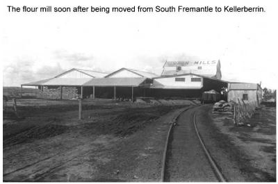 Black and White photograph Very early picture of Kellerberrin's Flour Mill.  Railway trucks in foreground leading to Mill