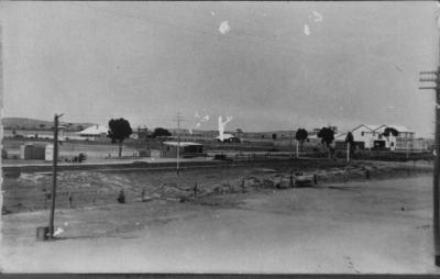 Black and White photograph.  The Flour Mill and Manager's house seen from Massingham Street in the early 1920's