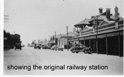 Black and White photograph.  Shops in the main street from West to East - Thornton Bros, Post Office, Bank of NSW, Kellerberrin Co-op