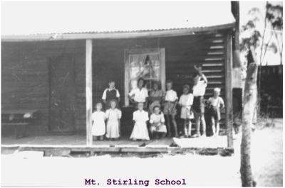 Black and White photograph Mt Stirling School Building with 11 students on verandah