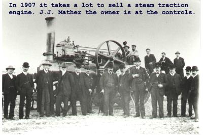 Black and White photograph.  J J Mather;s Steam Traction engine.  J J Mather at controls