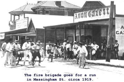 Black and White photograph The fire brigade goes for a run in Massingham Street