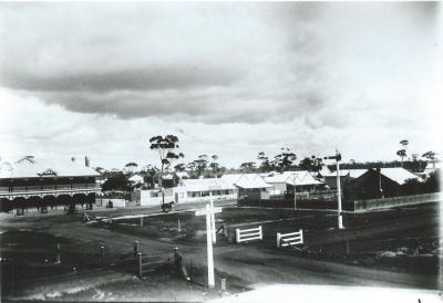 Black and White photograph.  From roof of Millars Plank and Timber Co.  East Railway Crossing - Kellerberrin Hotel looking West