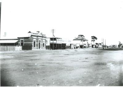 Black and White photograph looking West - includes National Australia Bank, Kellerberrin Co-op and Post Office