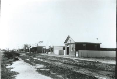 Black and white photograph.  Massingham St Central - Left Commercial Bank Right - Agricultural Bank, McCabes and Coop in the middle