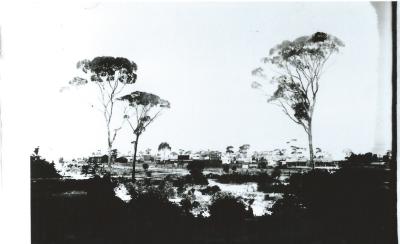 Black and White photograph.  Central Massingham Street from West Crossing large water tower completed