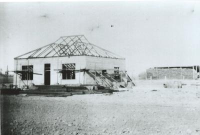 Black and White photograph.  Doodlakine May and Arthur Standring's new home. Arthur built concrete walls and concreted the rest.
