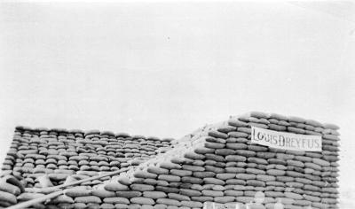 Stack of bags of wheat marked "Louis Dreyfus" at Esperance.