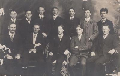 POSTCARD: GROUP OF TWELVE MEN