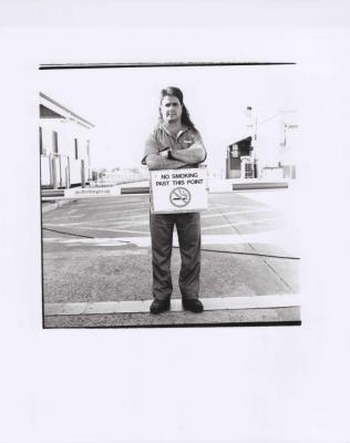 PHOTOGRAPH: WORKER AT THE ENTRANCE GATES OF BOC GASES, MICHELLE TAYLOR, 1997
