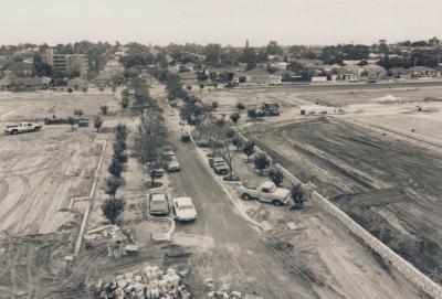 PHOTOGRAPH: CLEARED HUMES SITE PRIOR TO REDEVELOPMENT, SONYA SEARS, 1997