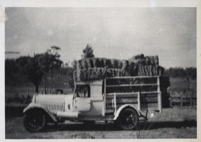 TRUCK LOADED WITH HAY BALES