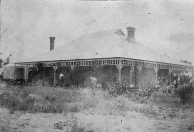 Emma Wilkinson on verandah at Wilkinson Homestead