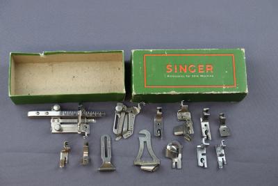 BOX OF SINGER SEWING MACHINE ATTACHMENTS FOR 201K MACHINE