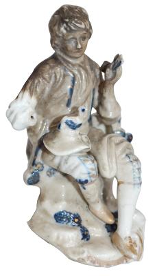 CERAMIC STATUE OF SITTING BOY FIRE DAMAGED