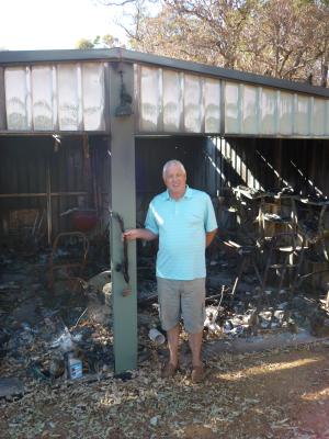 DIGITAL IMAGE - TERRY PATRICK OUTSIDE BUSHFIRE DAMAGED SHED