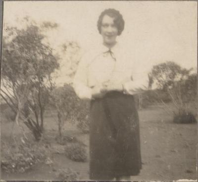 PHOTOGRAPH (DIGITAL COPY): WOMAN STANDING OUTSIDE, WHITE FAMILY