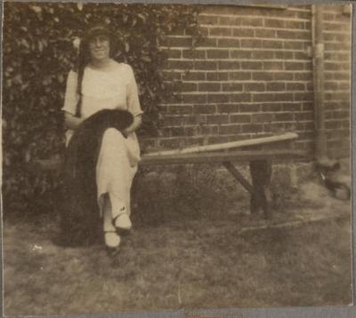 PHOTOGRAPH (DIGITAL COPY): WOMAN SITTING ON BENCH, WHITE FAMILY