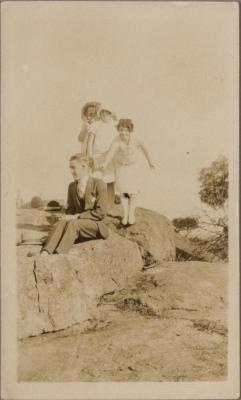 PHOTOGRAPH (DIGITAL COPY): MAN AND CHILDREN ON A ROCK, WHITE FAMILY