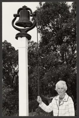 PHOTOGRAPH (DIGITAL): MISS ANNA ENGLUND RINGS THE SCHOOL BELL, JOLIMONT PRIMARY, FROM JOLIMONT HISTORICAL IMAGES ALBUM 3, DON GIMM