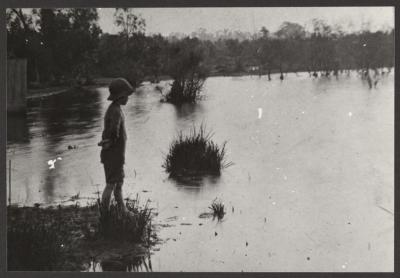 PHOTOGRAPH (DIGITAL): CHILD AT WATERS EDGE, JOLIMONT SWAMP, FROM JOLIMONT HISTORICAL IMAGES ALBUM 3, DON GIMM