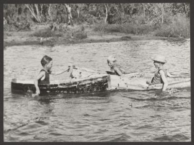 PHOTOGRAPH (DIGITAL): CHILDREN IN MAKESHIFT BOATS, JOLIMONT SWAMP, FROM JOLIMONT HISTORICAL IMAGES ALBUM 3, DON GIMM