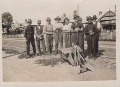 PHOTOGRAPH: GROUP OF MEN EMPLOYED ON TRAMLINES (TED RAWLINGS AT REAR)