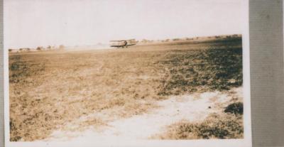 PHOTOGRAPH: BI-PLANE TIGER MOTH TAKING OFF IN PADDOCK