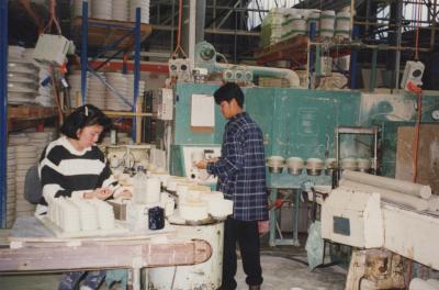 PHOTOGRAPH: WORKERS AT MACHINE IN AUSTRALIAN FINE CHINA FACTORY